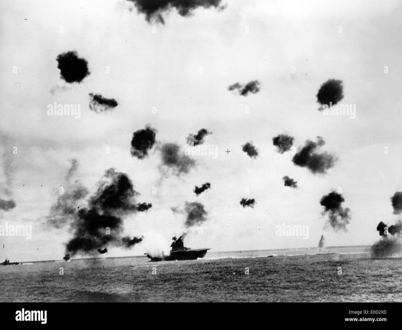 BATTLE OF MIDWAY  The USS Yorktown is hit portside by a torpedo from a Japanese Nakajima B5N on 4 June 1942 Stock Photo