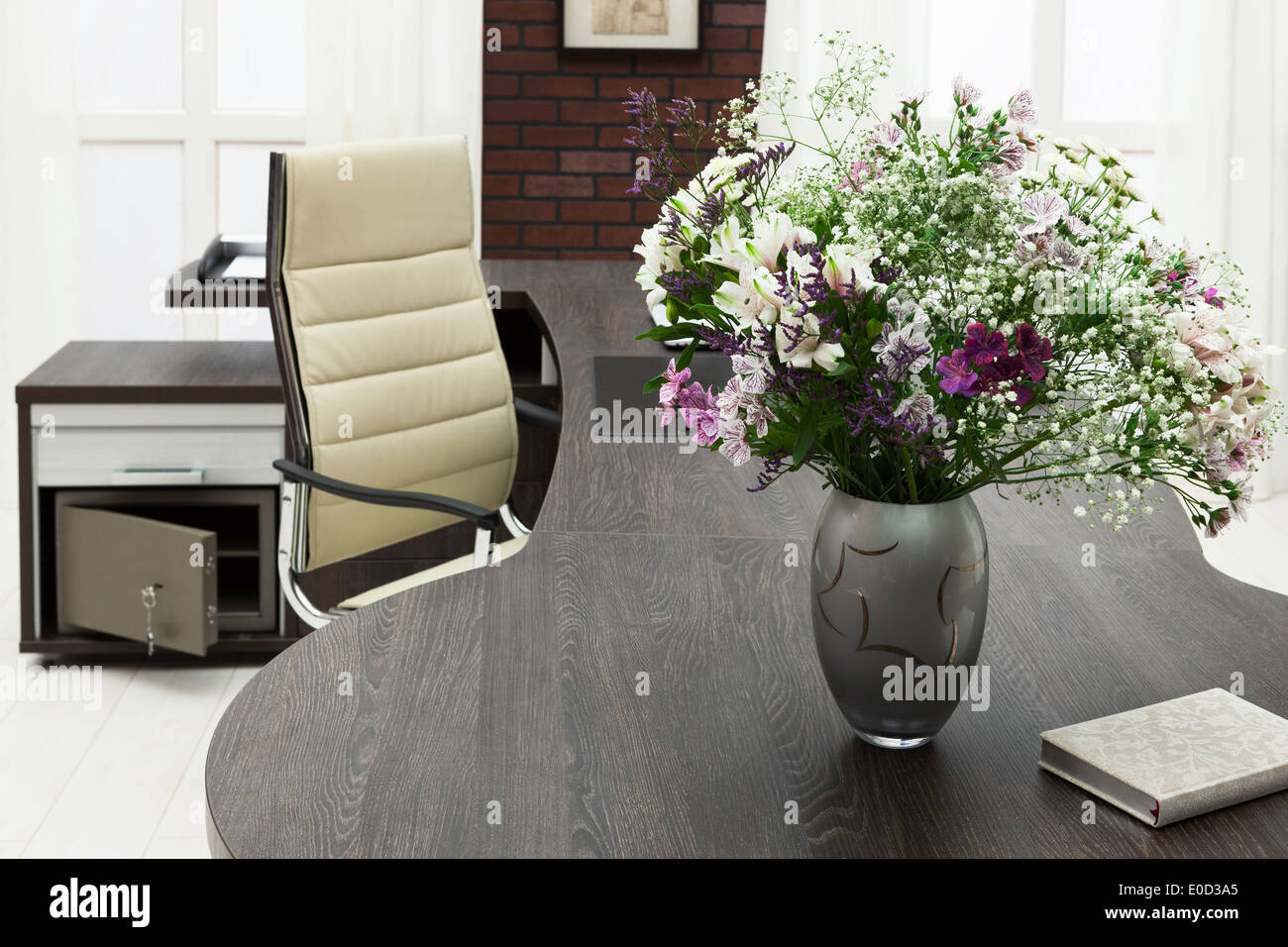 bouquet of flowers on a desk at modern office Stock Photo Alamy