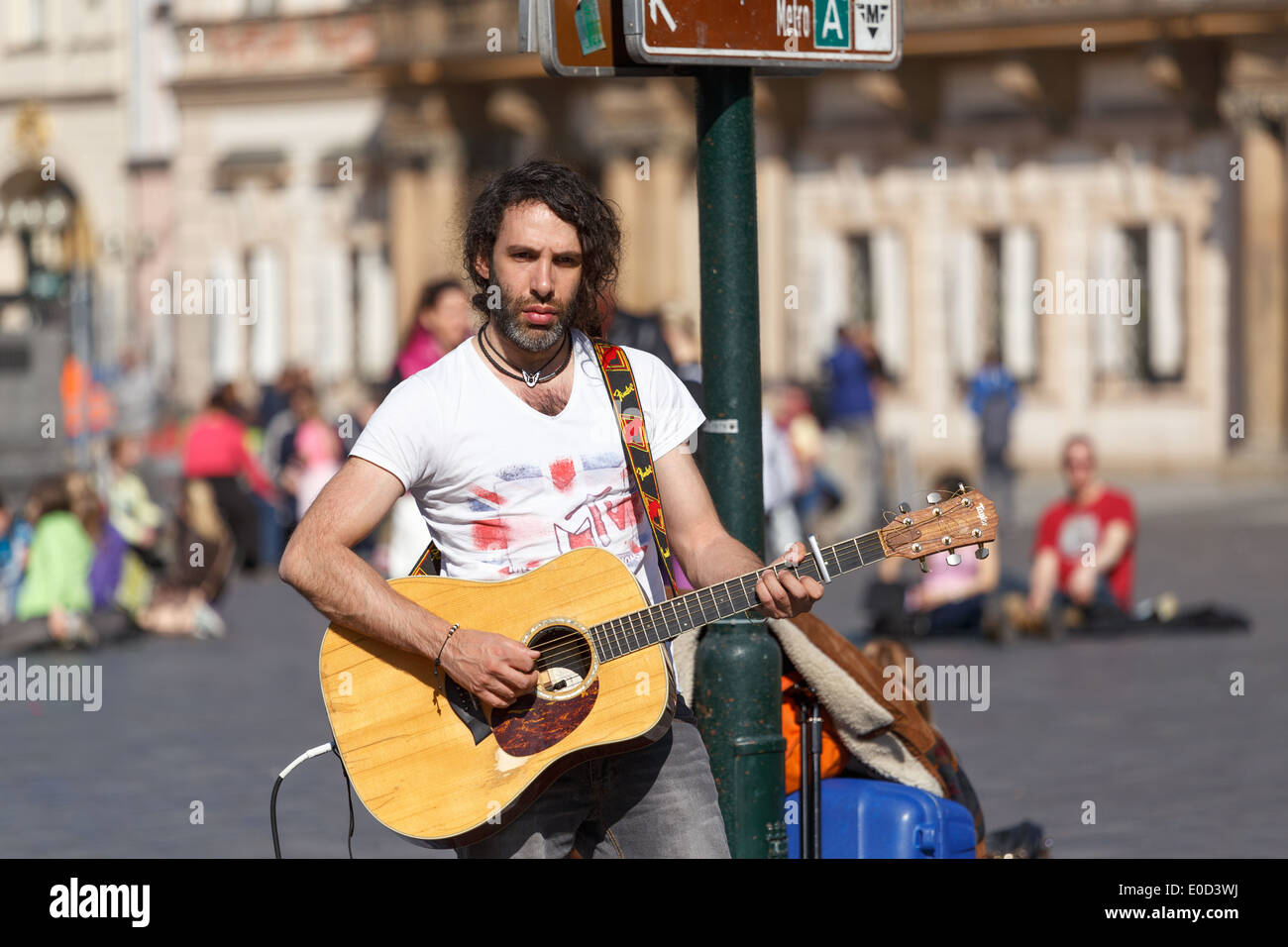 PRAGUE, CZECH REPUBLIC - MARCH 13th, 2014 - Foreign street musicians play and sign on Old Town Square in front of many tourists Stock Photo
