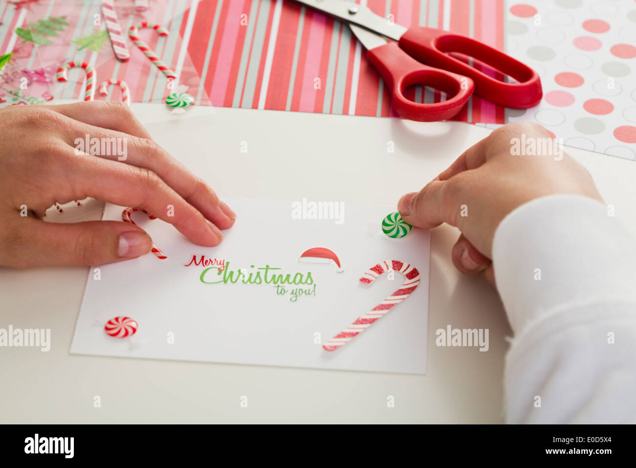 Girl (12-13) making Christmas card Stock Photo