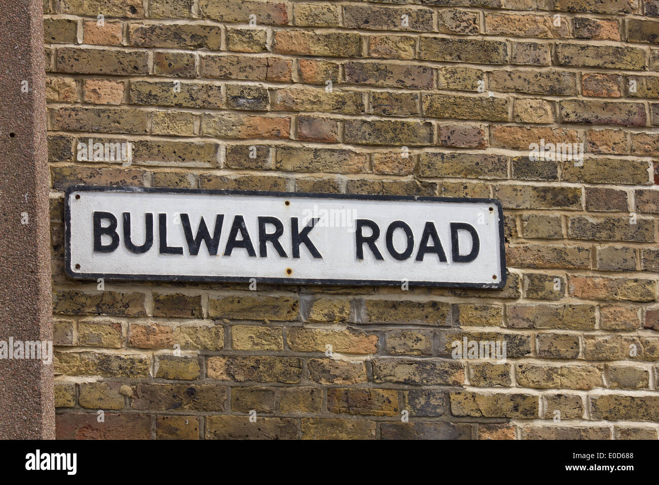 Street name Bulwark Road sign against a brick background Stock Photo