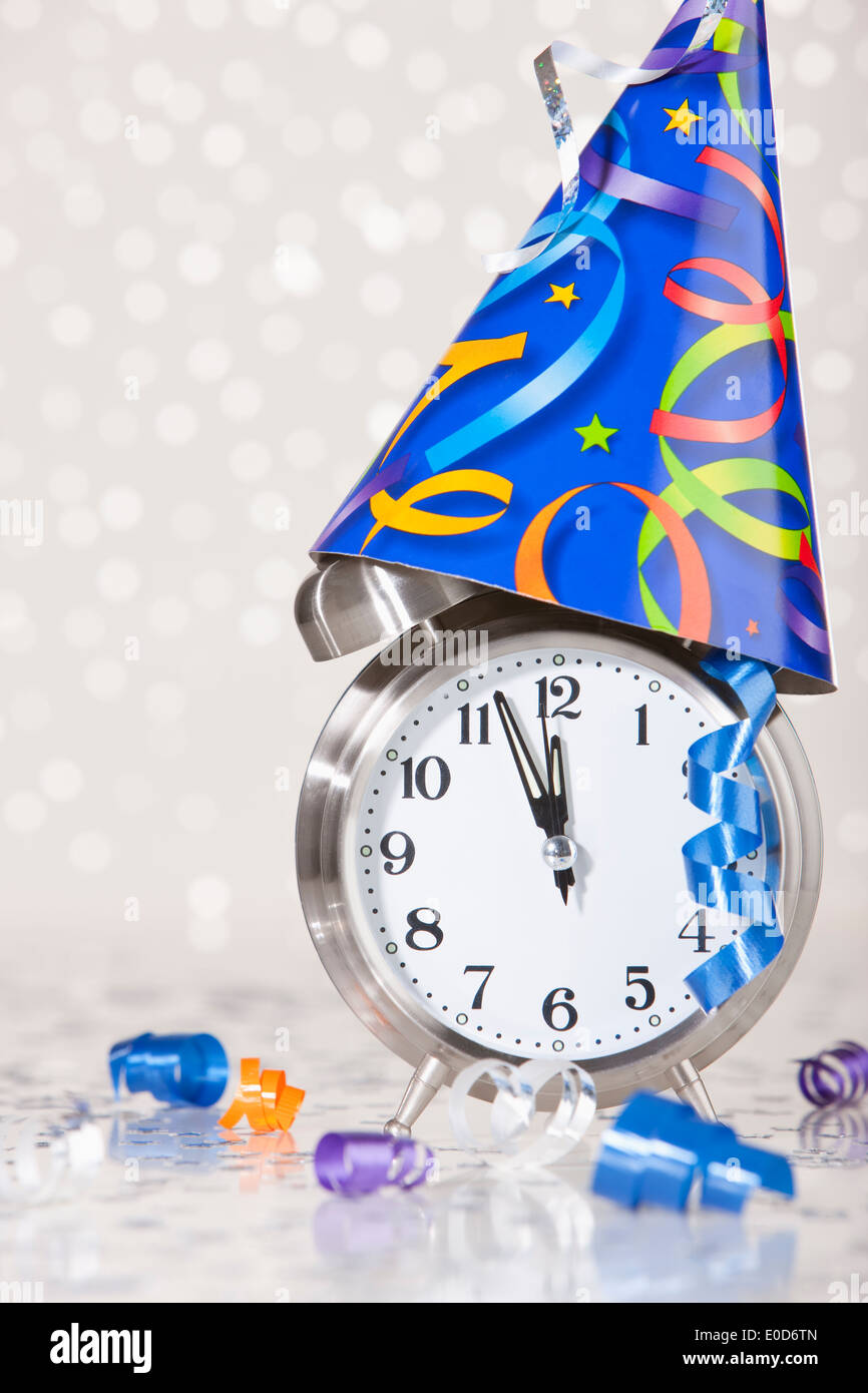 Alarm clock with party decoration Stock Photo Alamy