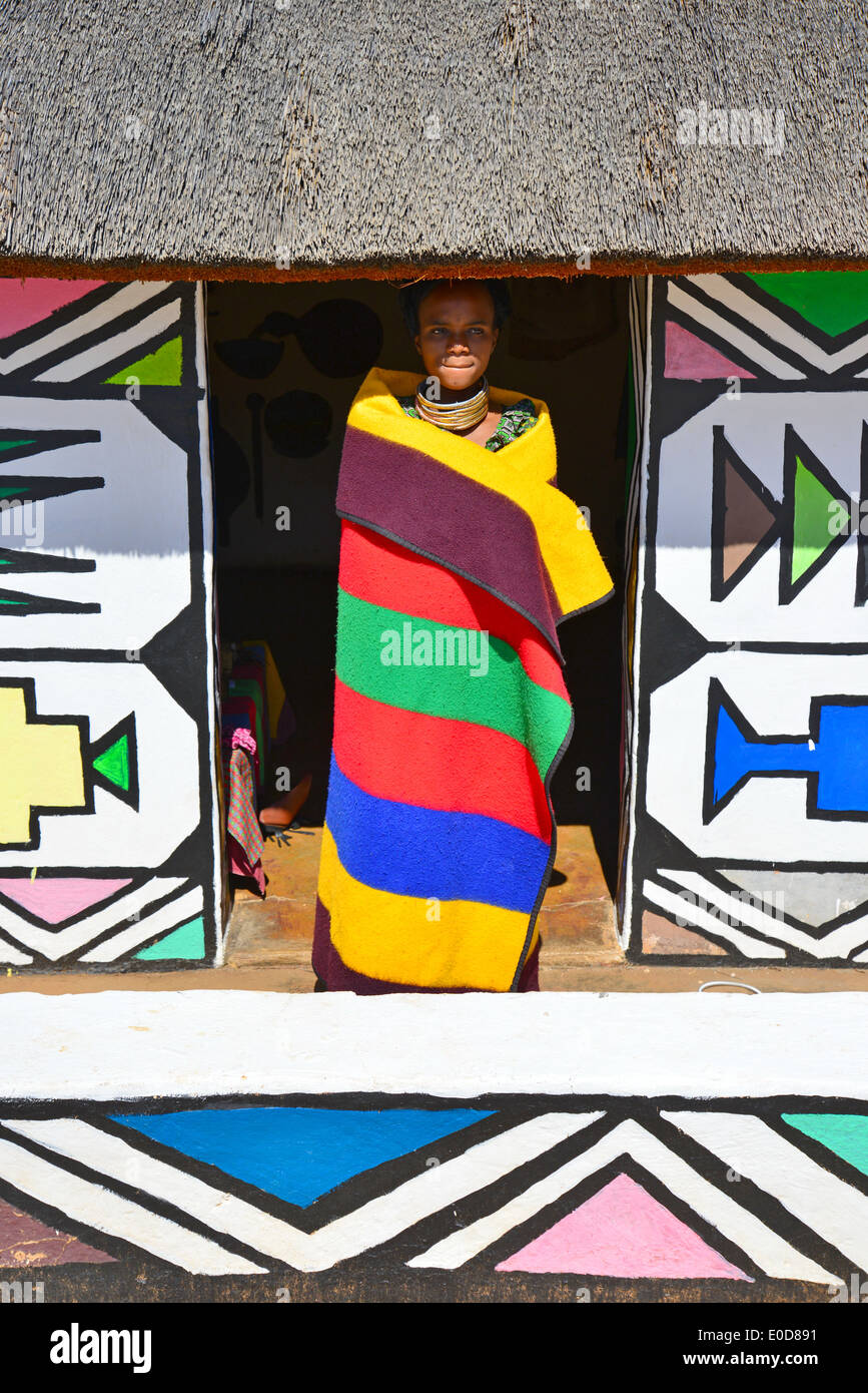 Ndebele woman and hut at Motseng Cultural Village, Sun City Resort, Pilanesberg, North West Province, Republic of South Africa Stock Photo