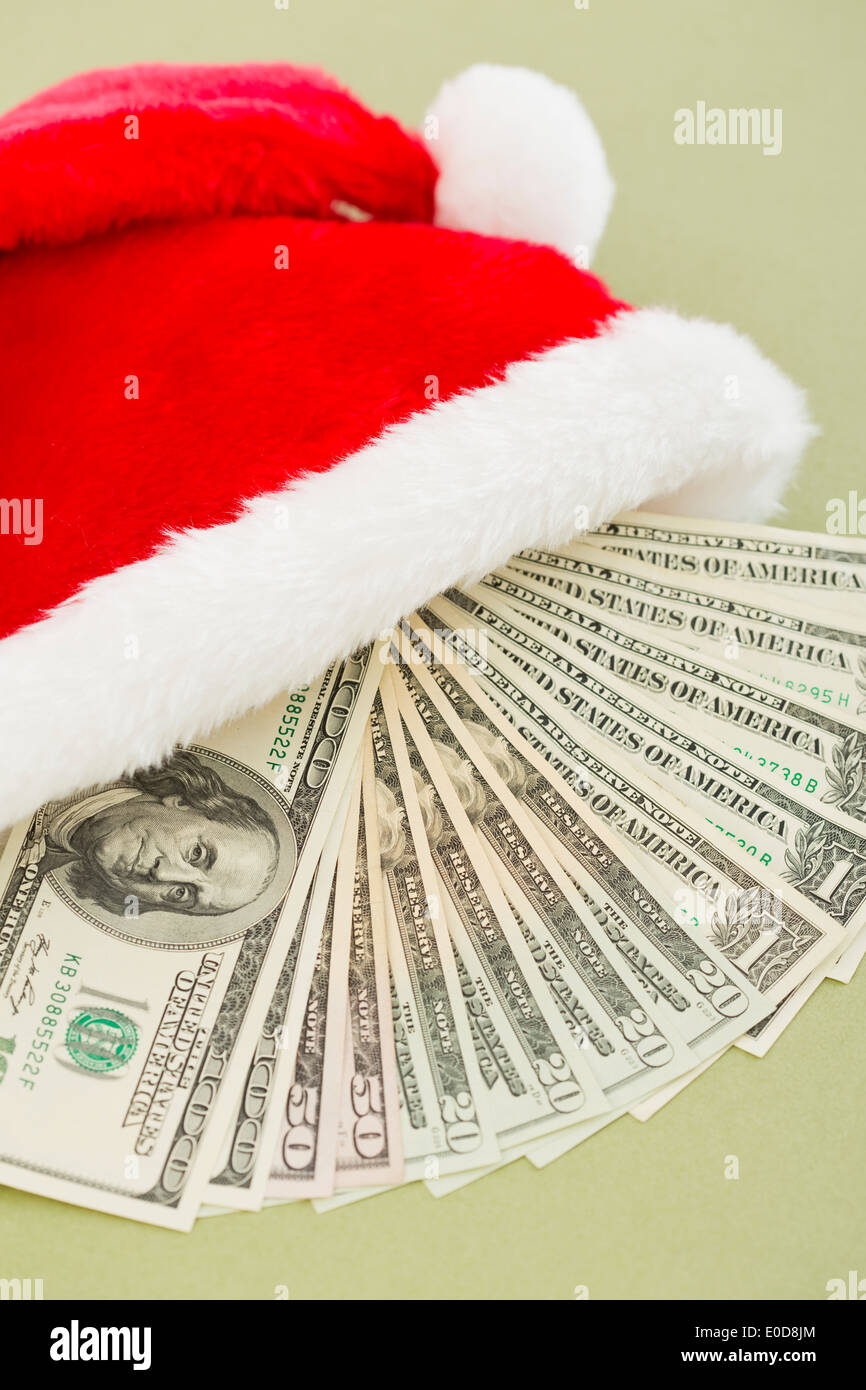 Studio shot of paper currency in santa hat Stock Photo