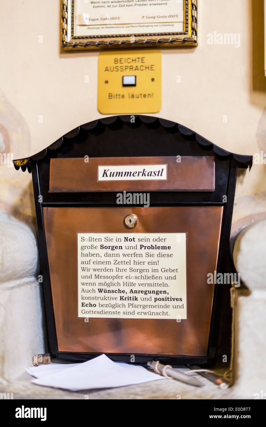 Grief box in a building of the church, Kummerkasten an einem Gebaeude der Kirche Stock Photo
