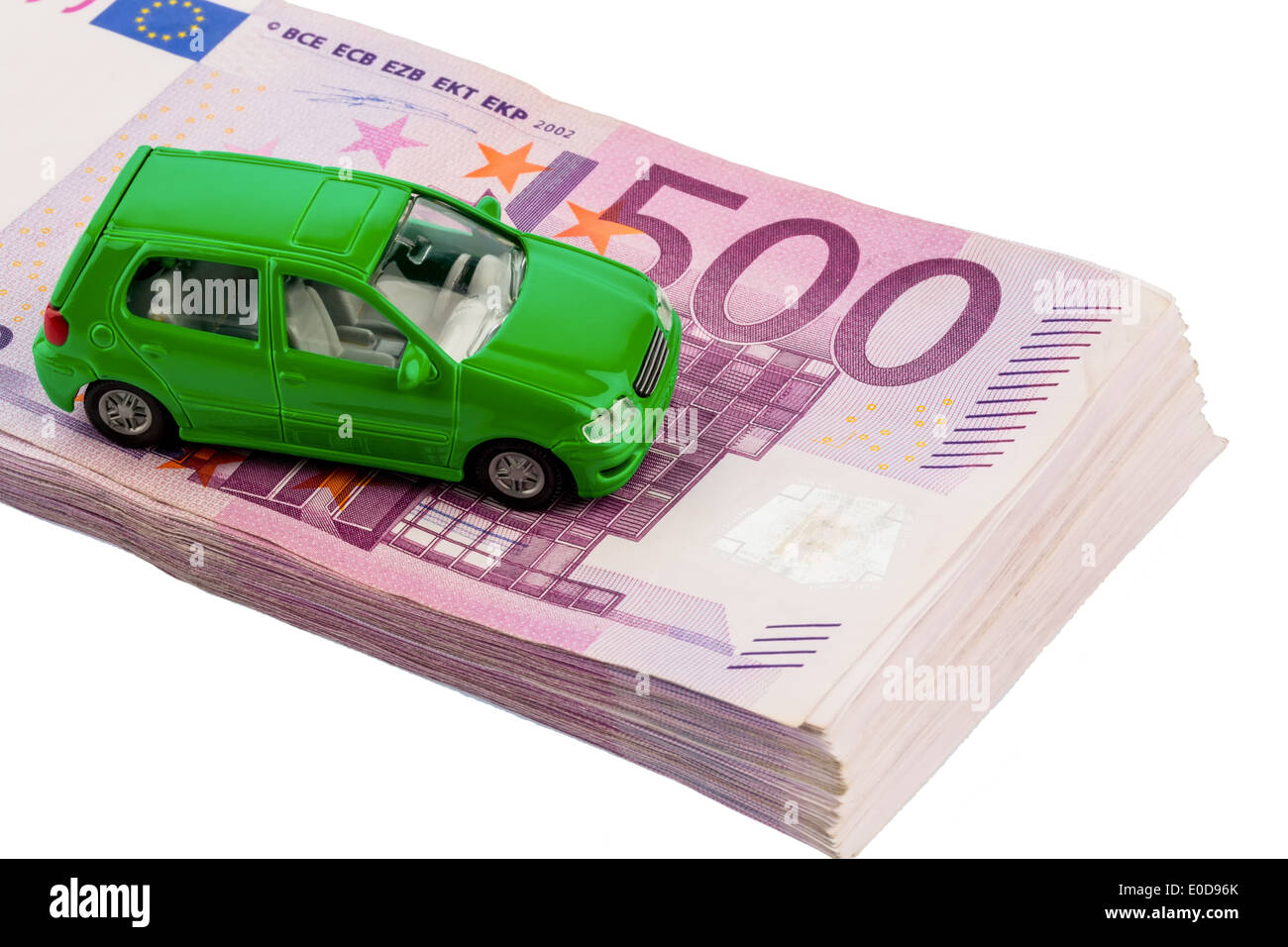 Green model car on bank notes, symbolic photo for autopurchase, financing and costs, Gruenes Modellauto auf Geldscheinen, Symbol Stock Photo