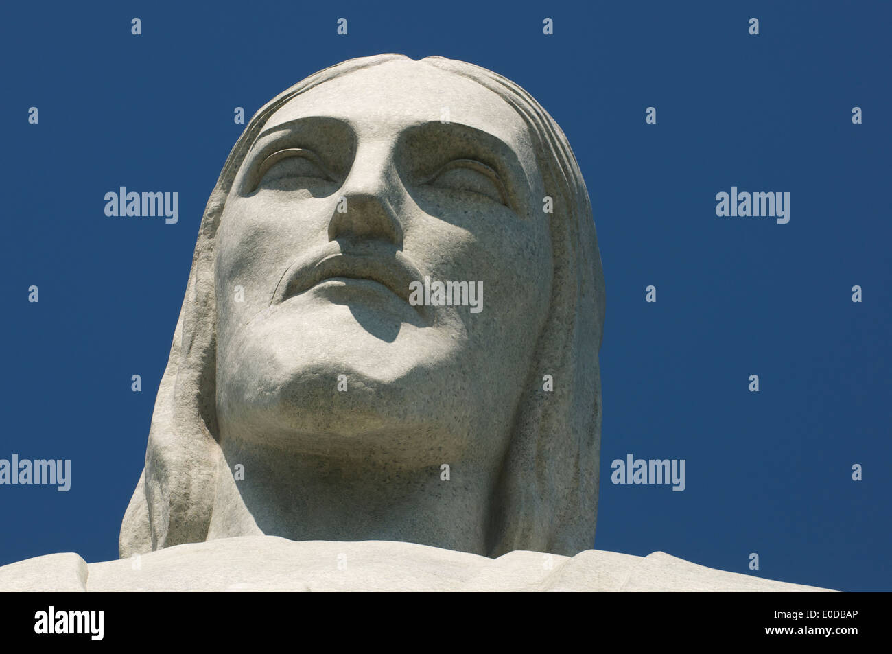 Christ the Redeemer at Corcovado close-up portrait of the face blue sky in Rio de Janeiro Brazil Stock Photo