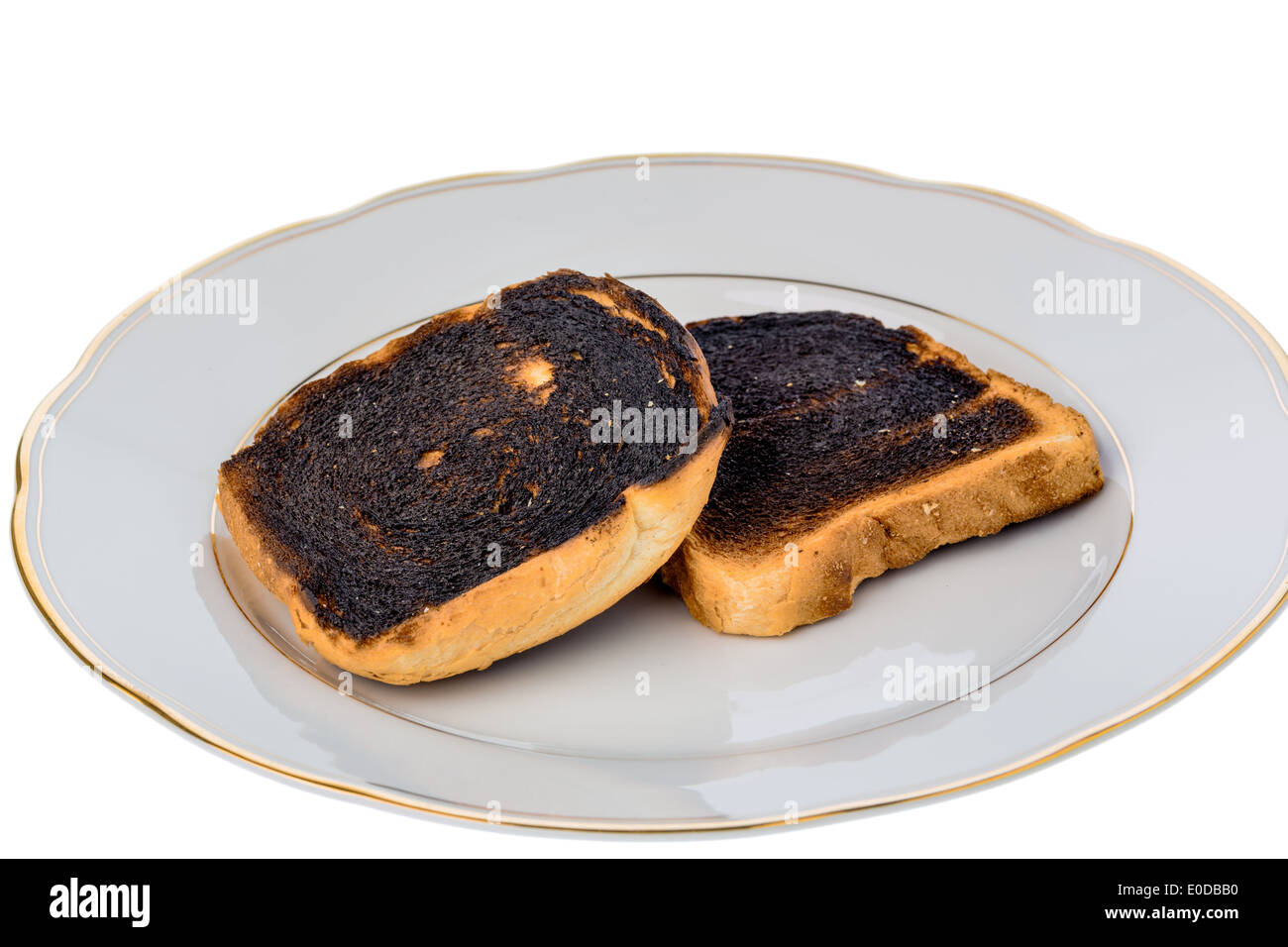 Toast bread became burntly. Burntly toast discs with the breakfast., Toastbrot wurde beim toasten verbrannt. Stock Photo