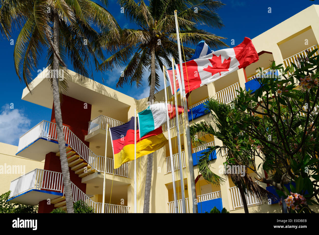 German French and Canadian flags at a hotel in downtown Varadero Cuba Stock Photo