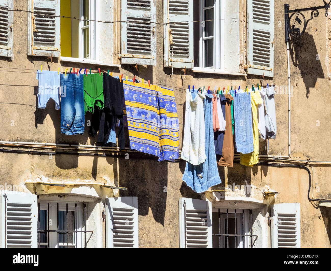Laundry on the rope before a window, Waesche auf der Leine vor einem Fenster Stock Photo