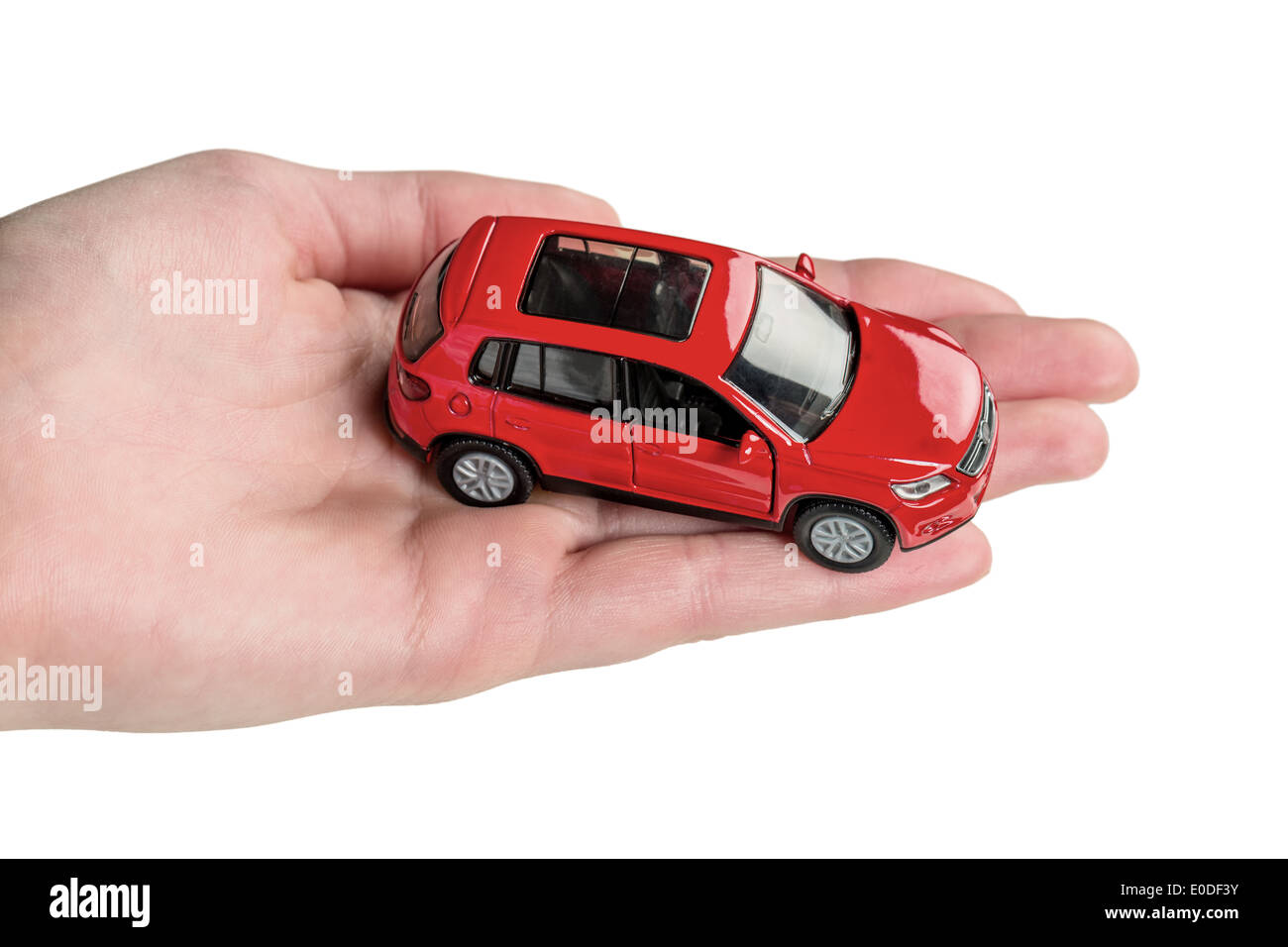 Hand holds model of a car, Hand haelt Modell eines Autos Stock Photo