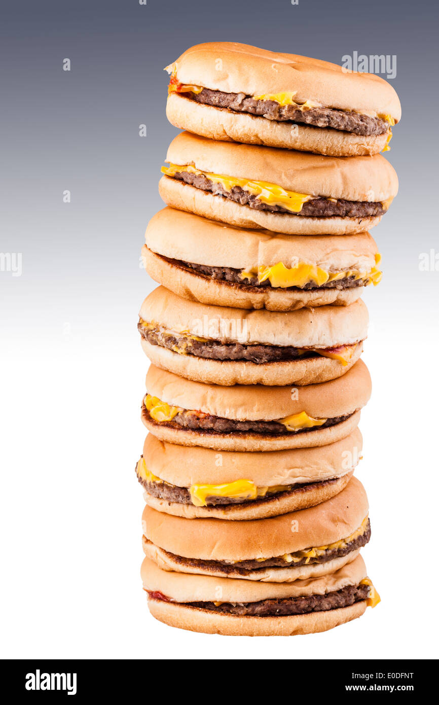 a very tall pile of cheesburgers representing gluttony or a very special fast food offer Stock Photo