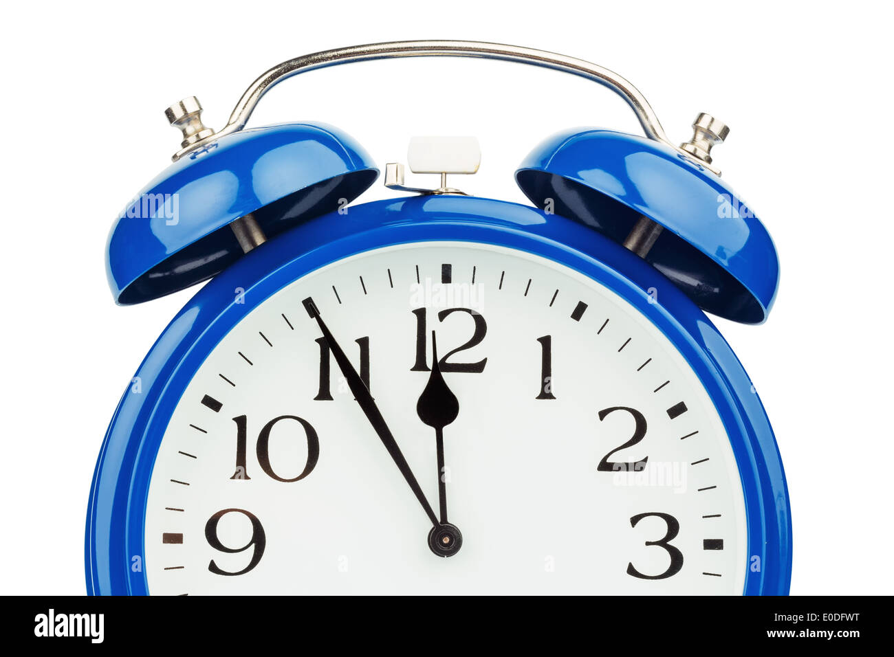 A blue alarm clock on white background. Five before twelve, Ein blauer Wecker auf weissem Hintergrund. Fuenf vor Zwoelf Stock Photo