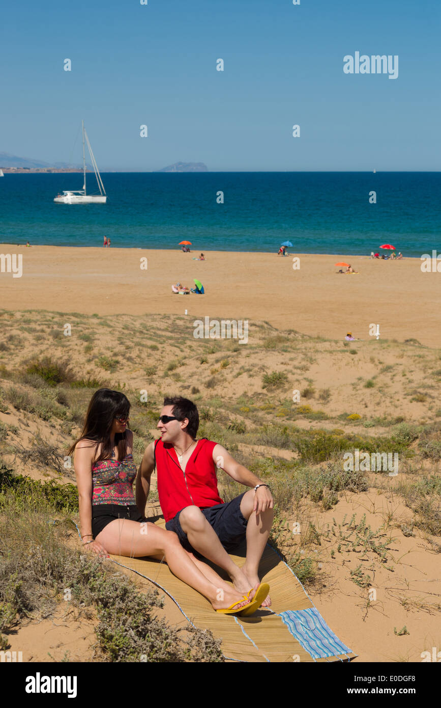 Couple enjoy on the beach in a sunny day Stock Photo