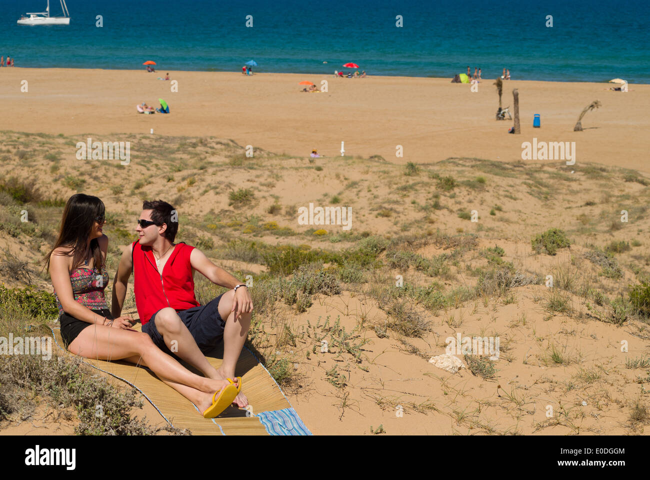 Couple enjoy on the beach in a sunny day Stock Photo