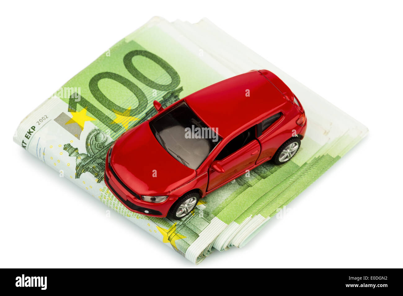 A car stands on euronotes. Costs for autopurchase, petrol, assurance and other autocosts, Ein Auto steht auf Euroscheinen. Koste Stock Photo
