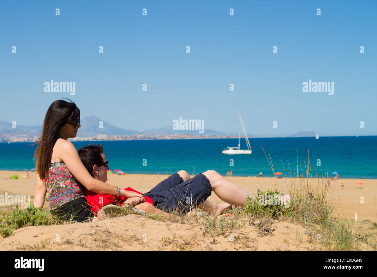 Couple enjoy on the beach in a sunny day Stock Photo