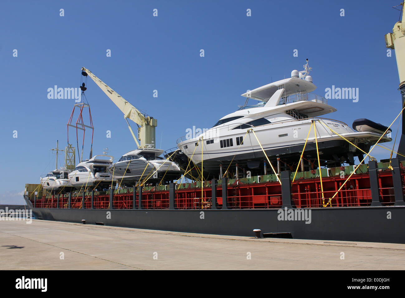 Luxury Motor Yachts - arriving in Palma de Mallorca on board MS Marmadura / Sevenstar Yacht Transport, Port of Palma de Mallorca Stock Photo