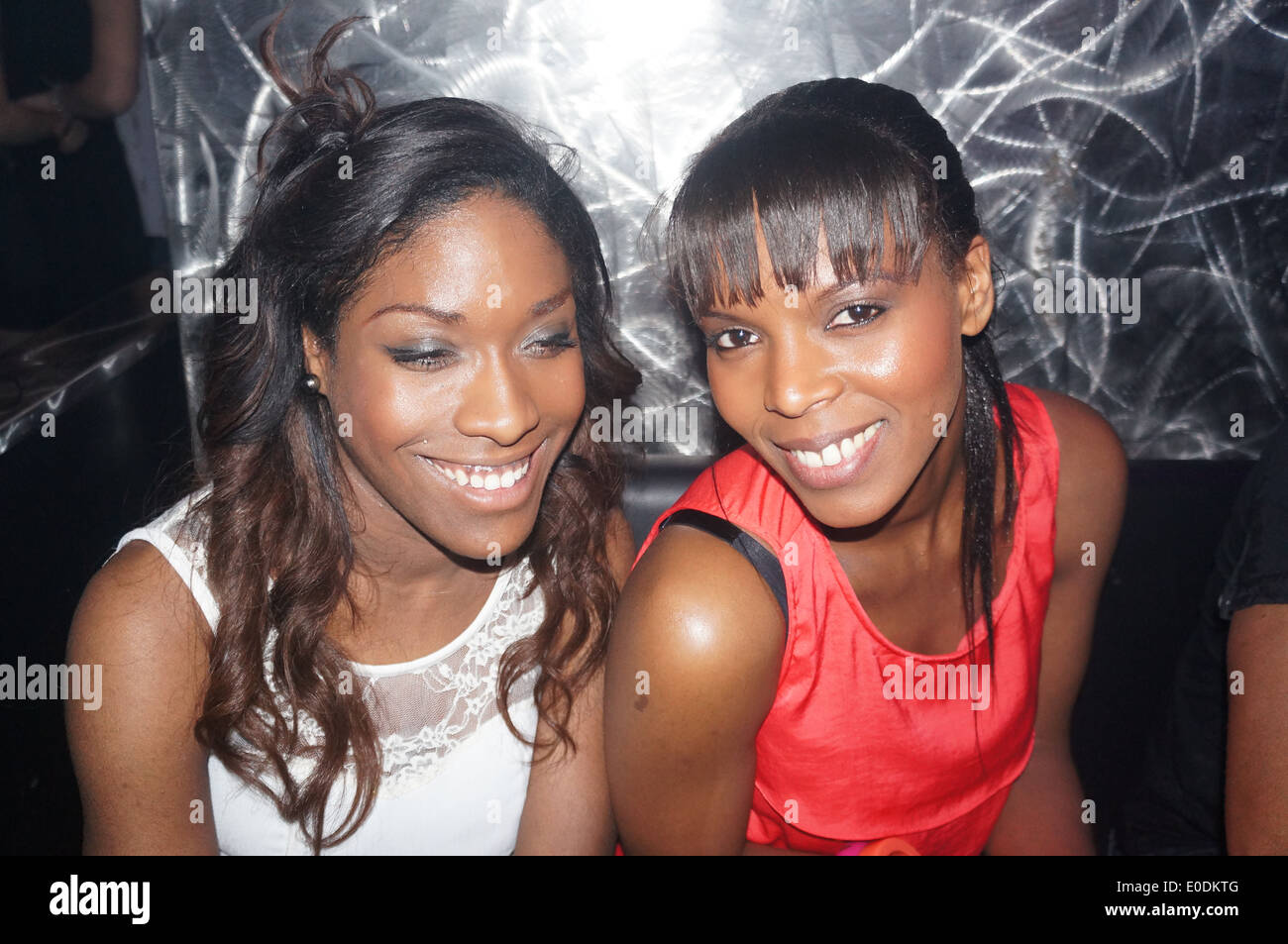 Two black women smiling on a night out Stock Photo