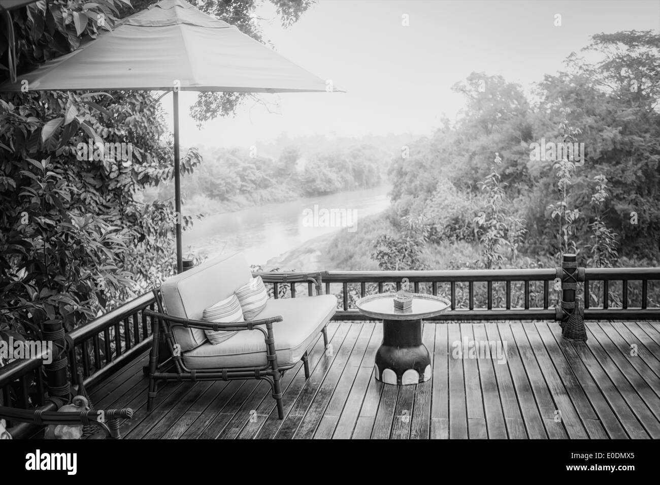 black and white armchairs and river view on the Terrace Stock Photo