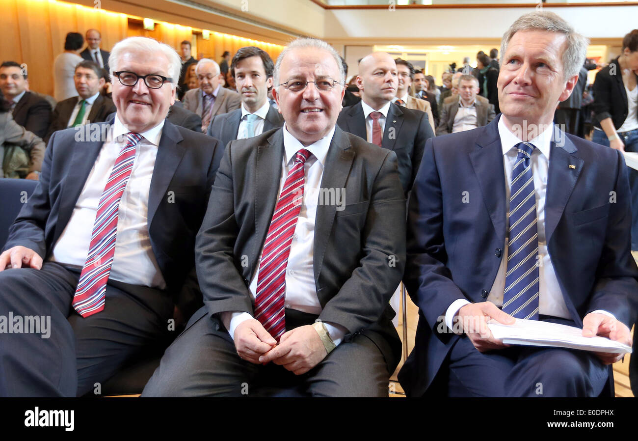 Berlin, Germany. 10th May, 2014. German Foreign Minister Frank-Walter Steinmeier (L) and Former German President Christian Wulff (R) sit with chairman of the community Kenan Kolat (C) during the 10th federal congress of the Turkish community in Germany in Berlin, Germany, 10 May 2014. Wulff has been distinguished for his efforts for equality among people of different cultures and religious backgrounds. Photo: WOLFGANG KUMM/dpa/Alamy Live News Stock Photo