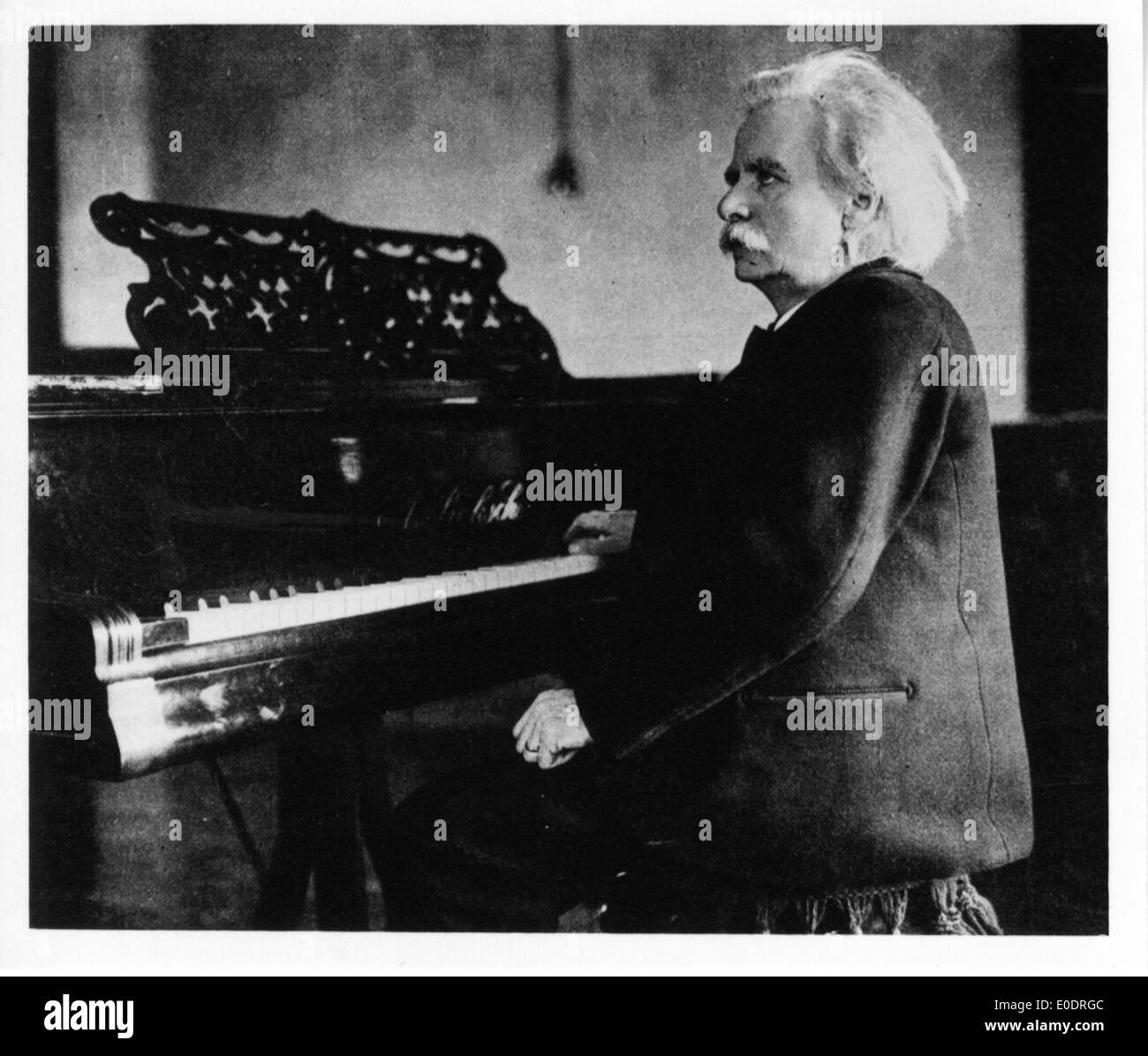 Edvard Grieg by the piano Stock Photo