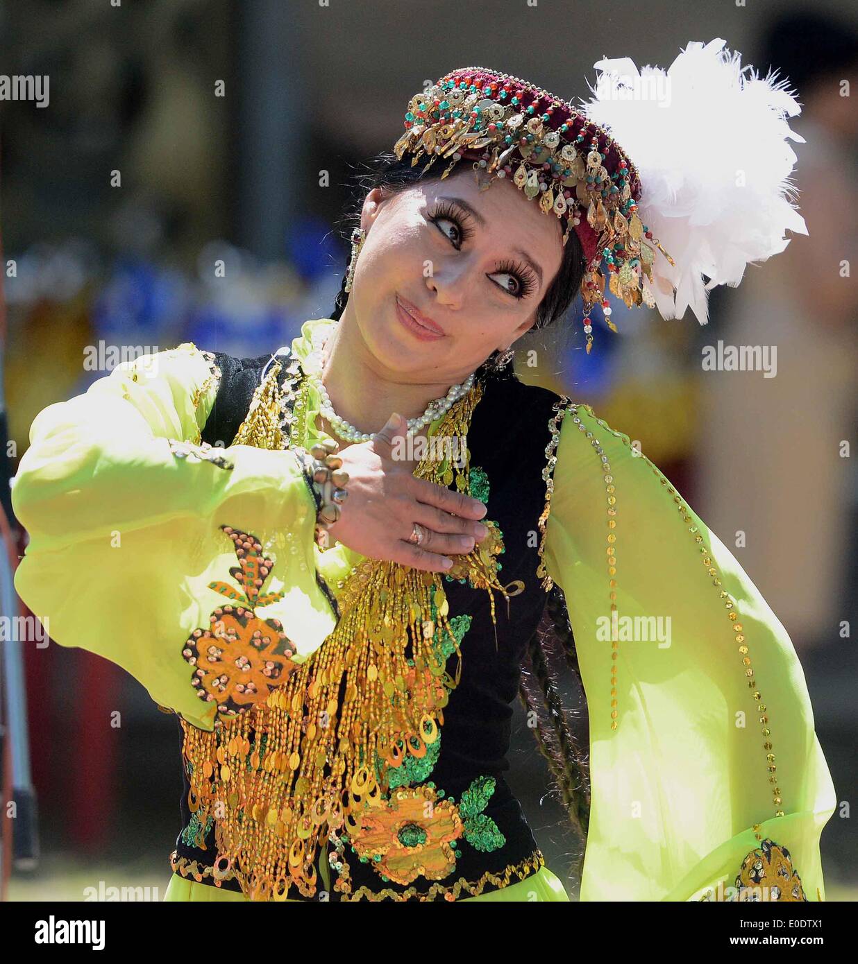 Tashkent, Uzbekistan. 10th May, 2014. A performer dances during the 12nd Uzbekistan foreign mission traditional culture and folk cuisine feast in Tashkent, Uzbekistan, May 10, 2014. The 12nd Uzbekistan foreign mission traditional culture and folk cuisine feast opened on Saturday. Credit:  Sadat/Xinhua/Alamy Live News Stock Photo