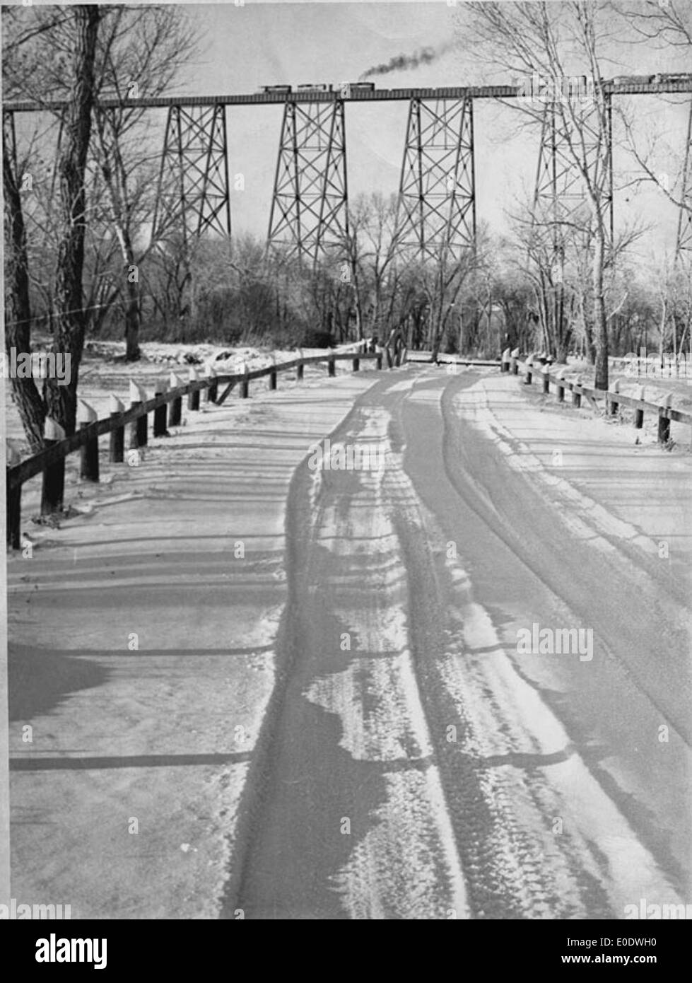 Snow Covered Road In Indian Battle Park; Viaduct In Background Stock Photo