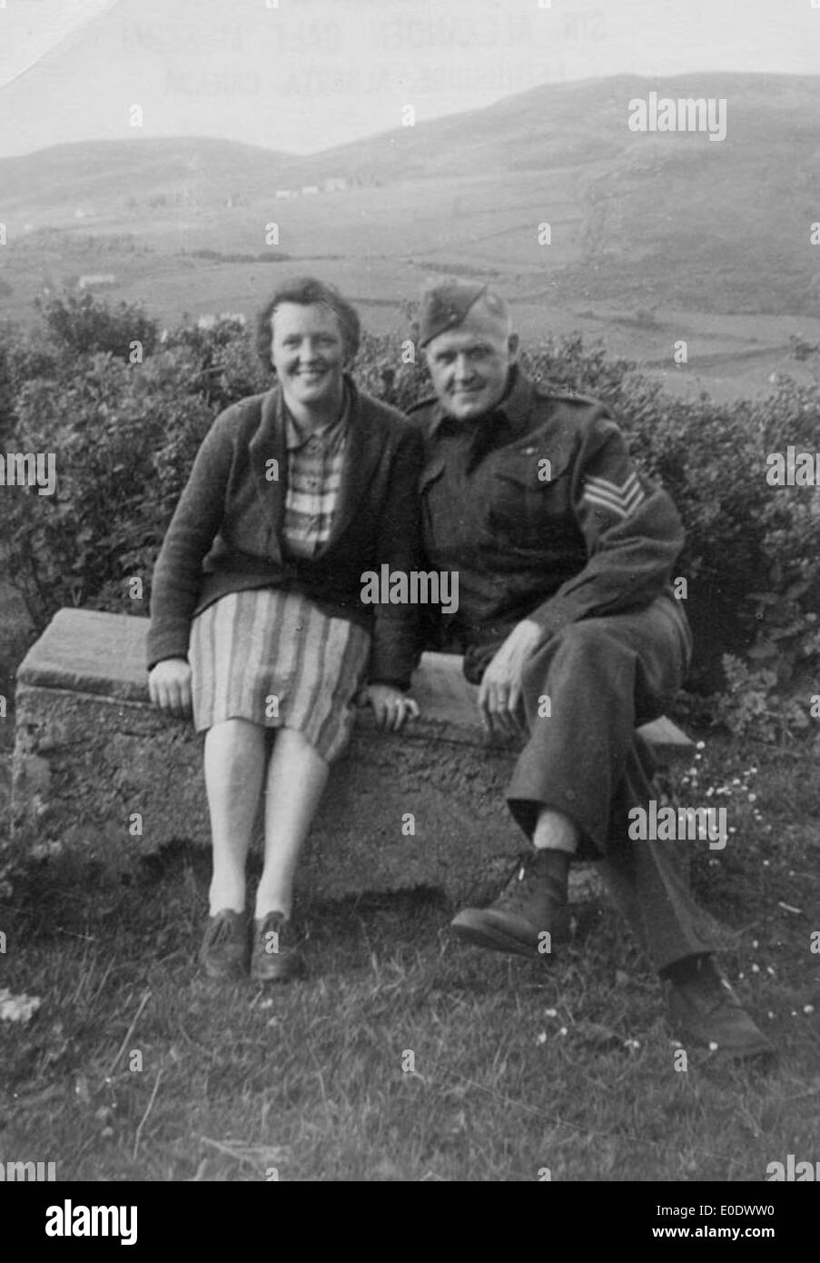 Sergeant In Canadian Army And A Woman On Bench In Britain Stock Photo