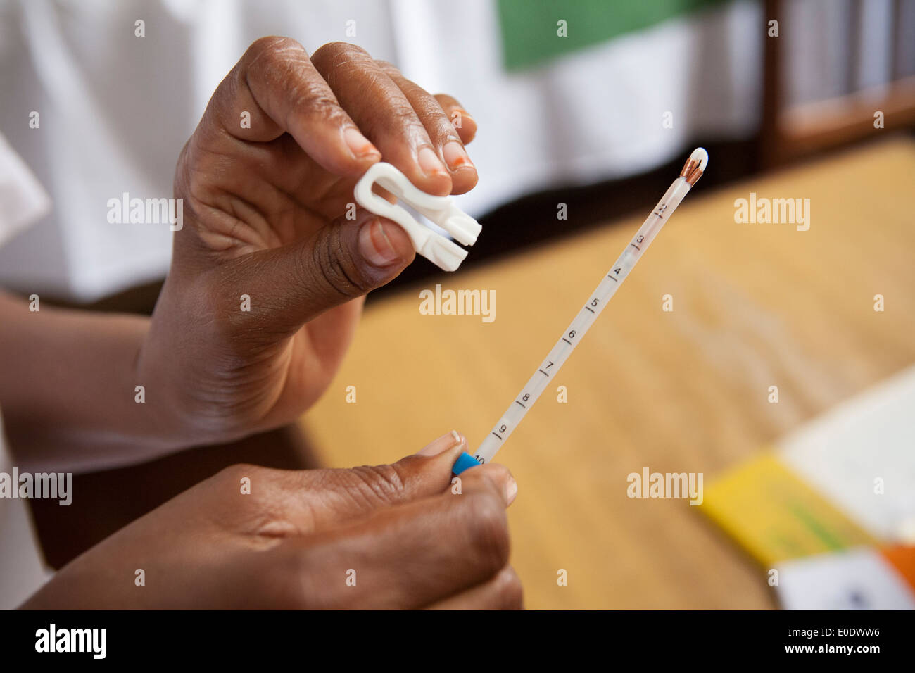 A nurse measures an IUD at a family planning clinic in Dar es Salaam ...