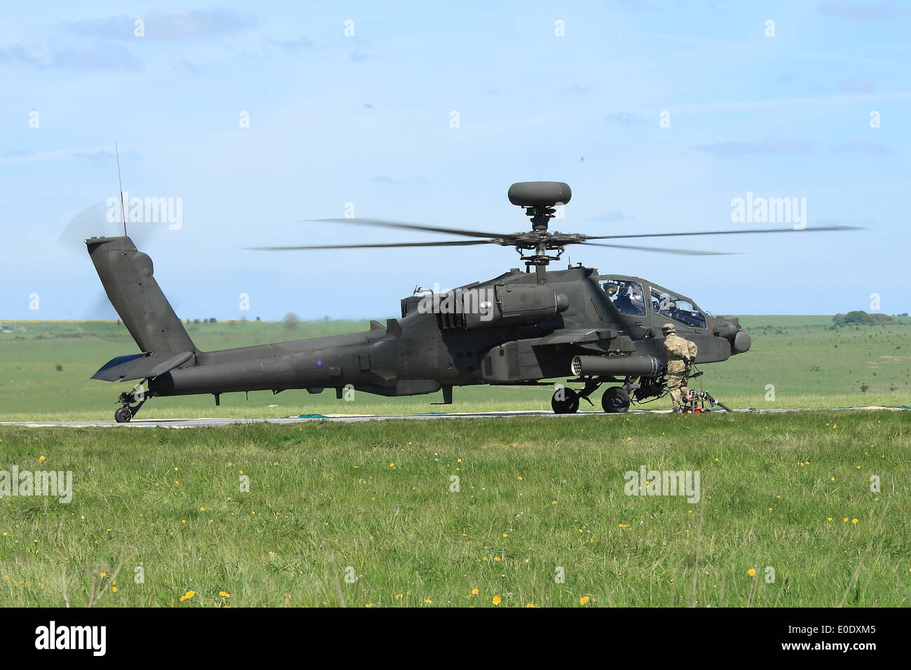 Apache AH1 Longbow helicopter refuels in the field during Exercise Patshun Dawn Stock Photo