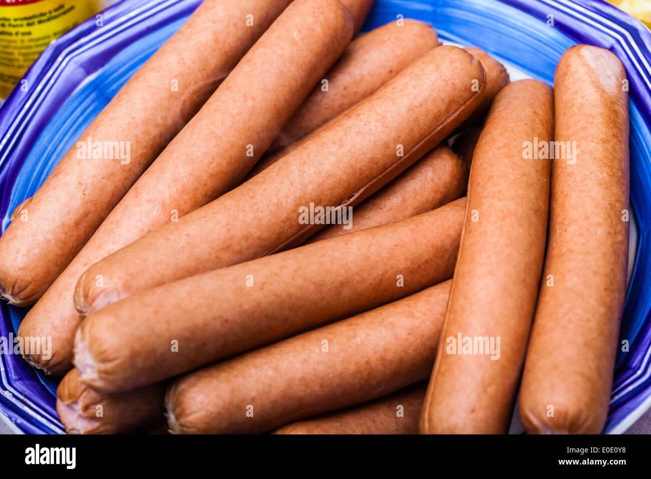a bowl filled up with a lot of steaming wiener sausages Stock Photo