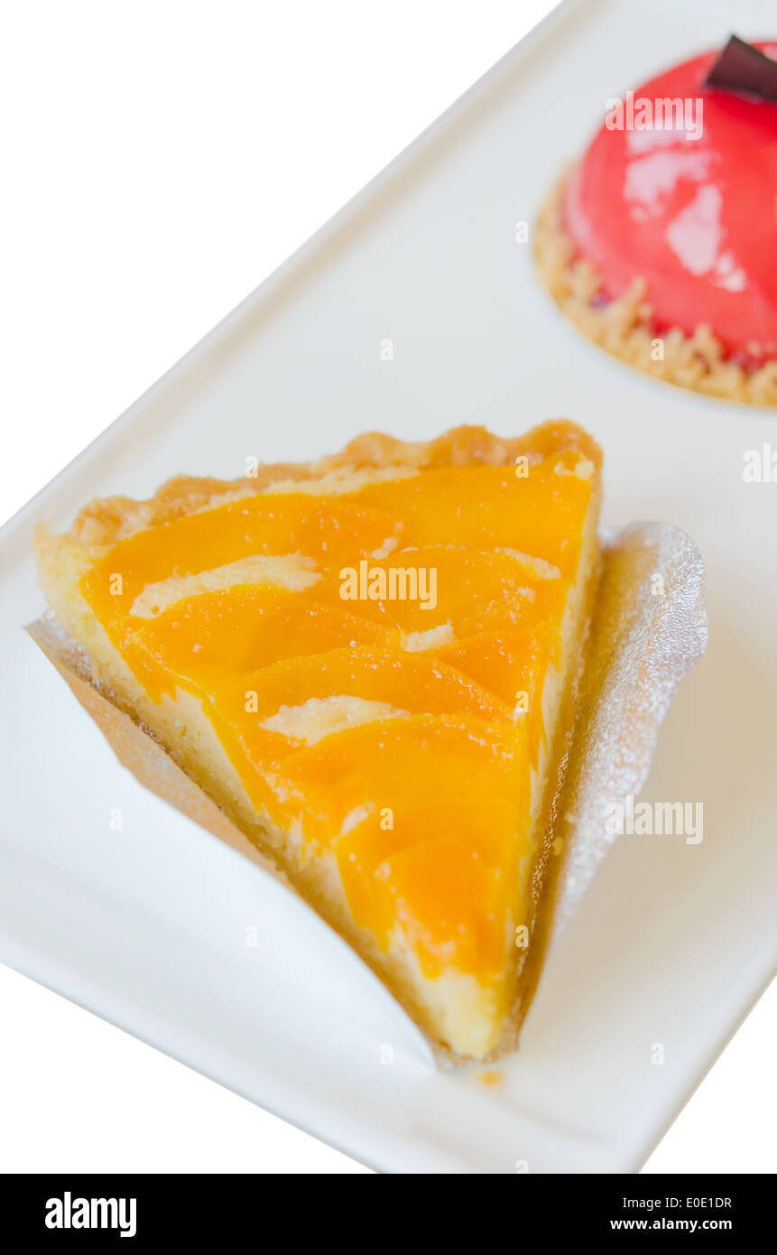 piece of peach tart on dish , fruit dessert Stock Photo