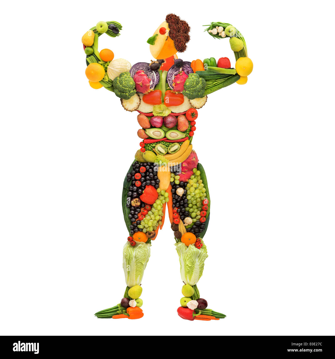 Fruits and vegetables in the shape of a healthy posing muscular bodybuilder. Stock Photo