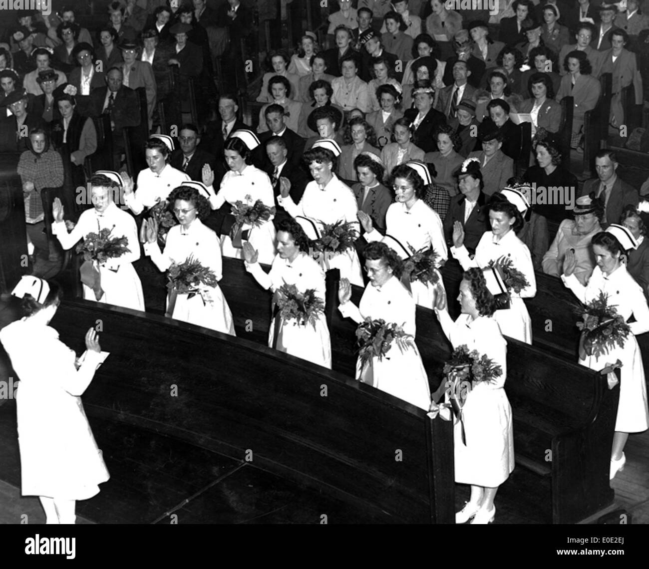 Graduates reciting Florence Nightingale Pledge Stock Photo