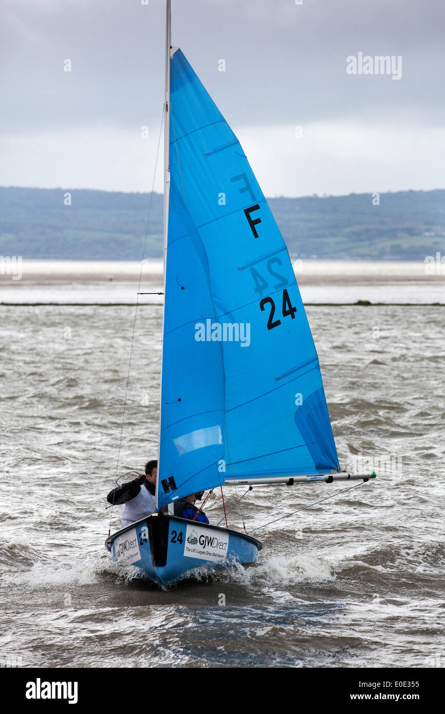 West Kirby, Liverpool. 10th May, 2014.  GJW Direct 24 at the British Open Team Racing Championships Trophy 2014.  Sailing’s Premier League ‘The Wilson Trophy’ 200 Olympic-class sailors compete annually on Kirby’s marine amphitheatre in one of the World’s favourite events where hundreds of spectators follow 300 short, sharp frenzied races in three-boat teams jostling on the marina lake to earn the coveted title: “Wilson Trophy Champion.” Stock Photo