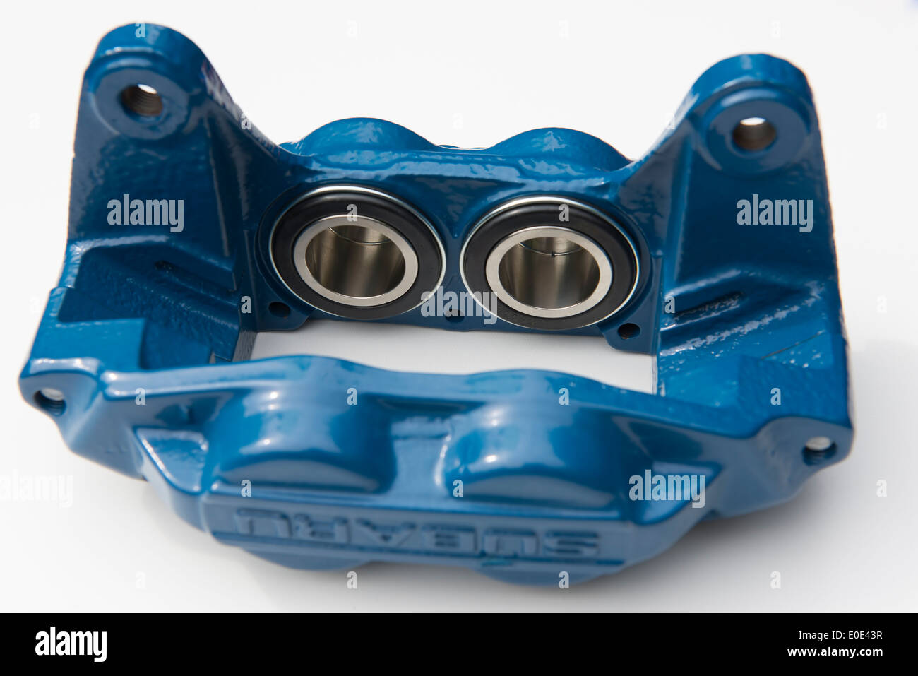 Reconditioned car brake caliper showing stainless steel pistons Stock