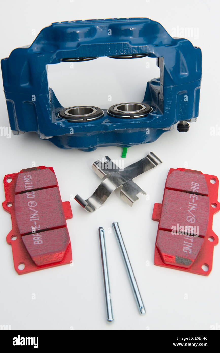 Components of a car brake caliper ready for assembly Stock Photo