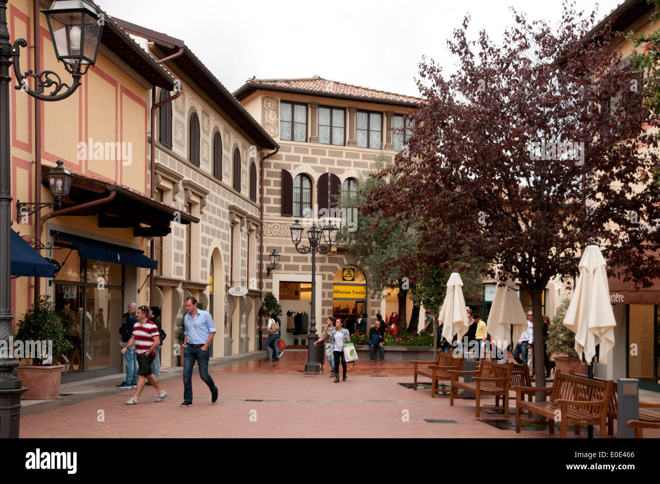 People shopping in McArthurGlen Barberino Designer Outlet arcade Stock Photo: 69152110 - Alamy
