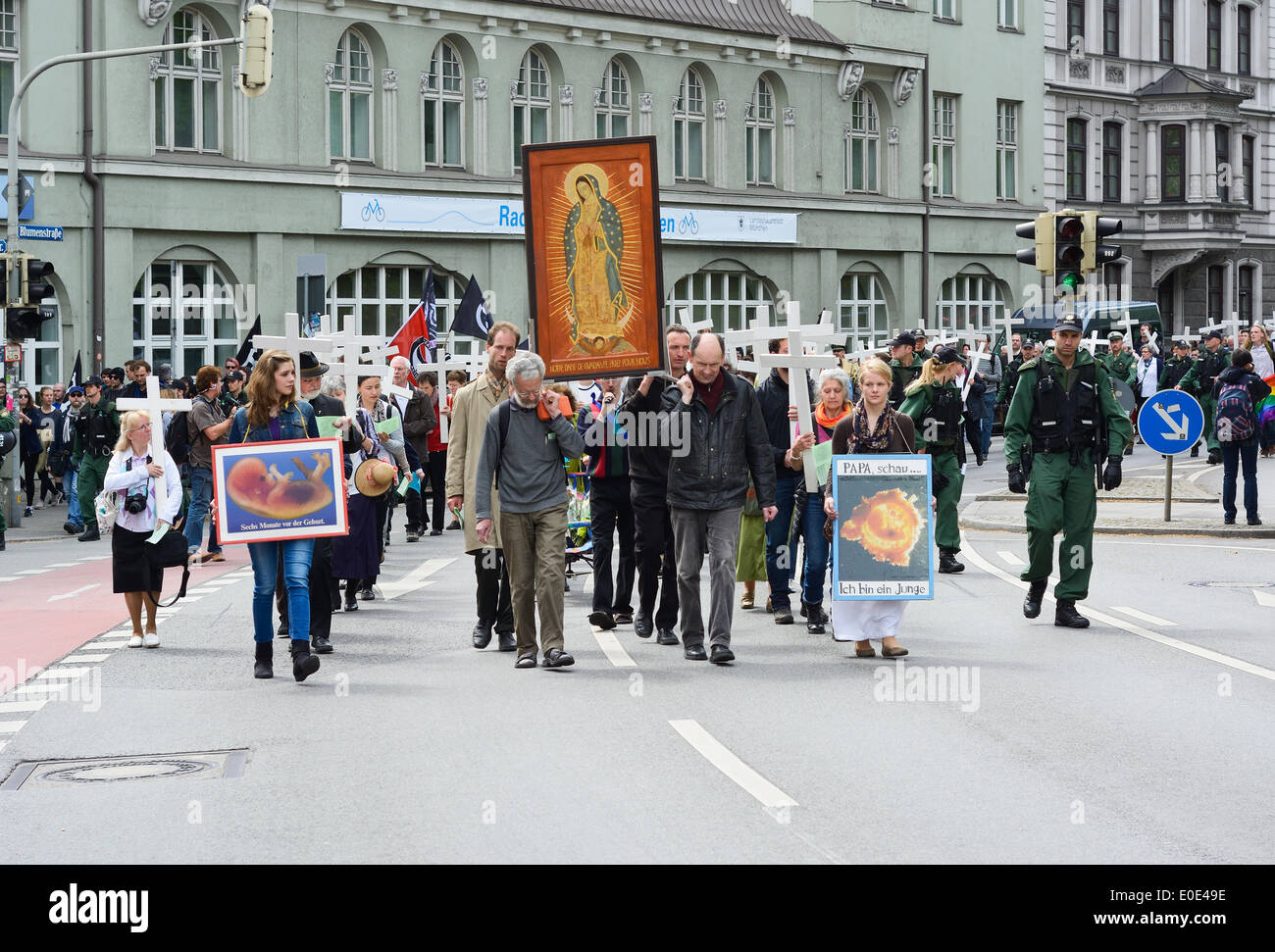 MUNICH, GERMANY – MAY 10, 2014:  Anti-Abortion Demonstration with participants carrying Christian Crosses and banners. Stock Photo