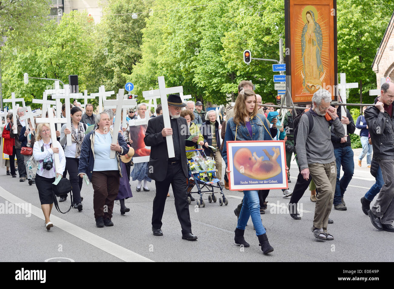 MUNICH, GERMANY – MAY 10, 2014:  Anti-Abortion Demonstration with participants carrying Christian Crosses and banners. Stock Photo
