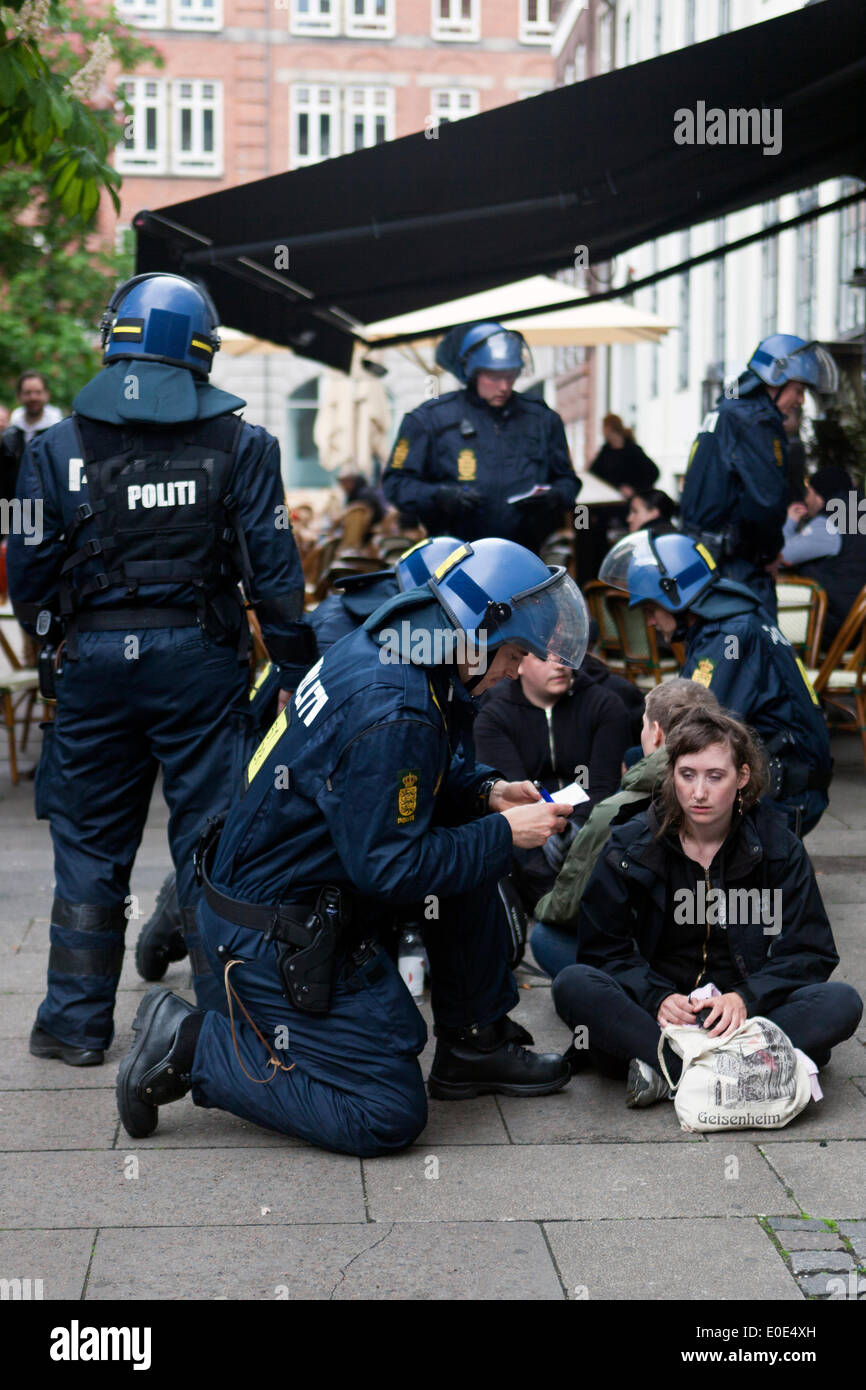Copenhagen, Denmark. 10th May, 2014. Following the demonstration and subsequent clashes at the Danish neo-Nazi party (Denmark National Front, DNF) demonstration in front of the parliament, police arrested 11. Here 3 young peole is arrested. The neo-Nazi demonstration took place under the slogan: “No to Islamization” and was met by an anti fascist counter-demonstration. Eventually police cleared the square. This took place just a few hours before the Eurovision Song Contest final. Credit:  OJPHOTOS/Alamy Live News Stock Photo