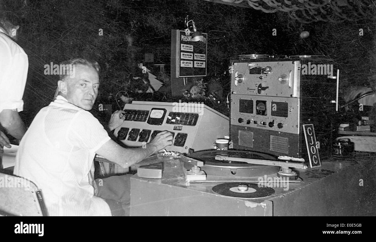 39. Who is this CJOC Radio announcer playing records at a banquet? Stock Photo