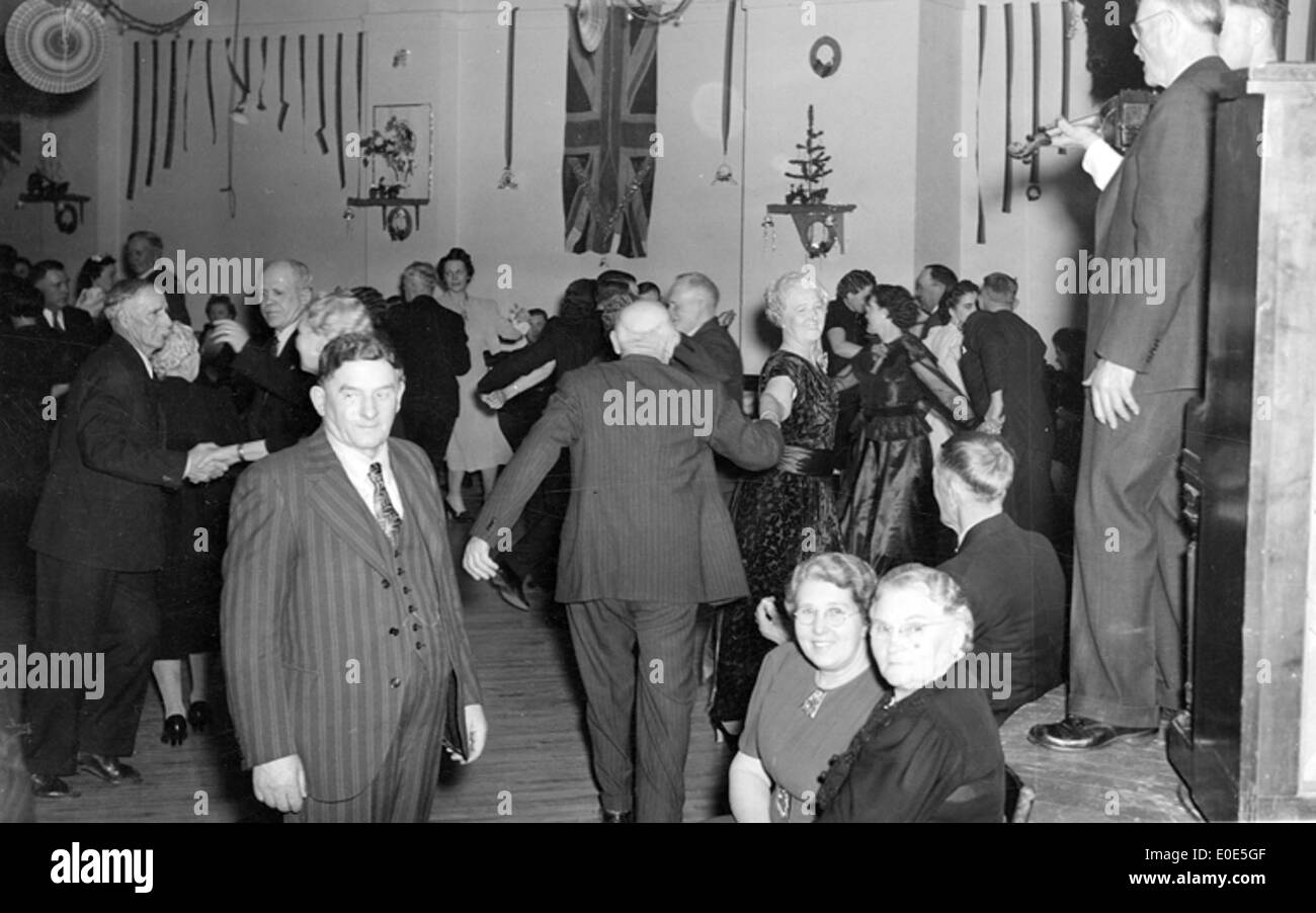 38. Square dancing at a Christmas Party. Which hall is it? Do you recognize any of the people? Stock Photo