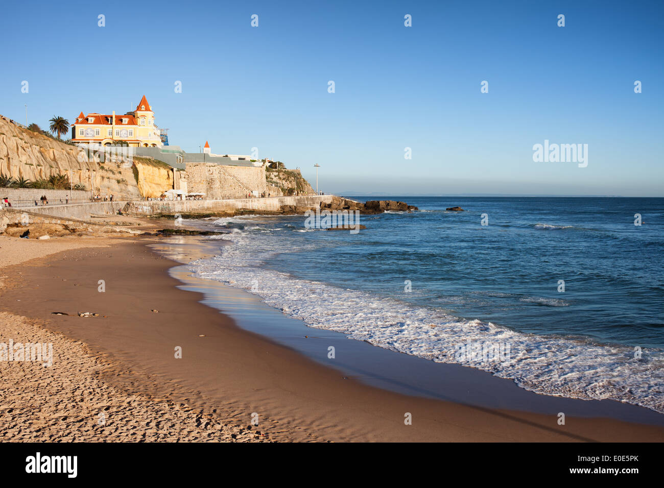 Beach, cliff and promenade along the Atlantic Ocean coast in resort town of Estoril in Portugal. Stock Photo