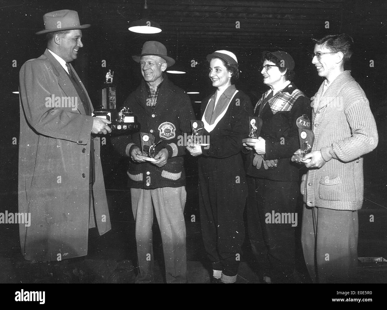 06. Who are these people at the Shirt Sleeve Bonspiel trophy presentation? Stock Photo