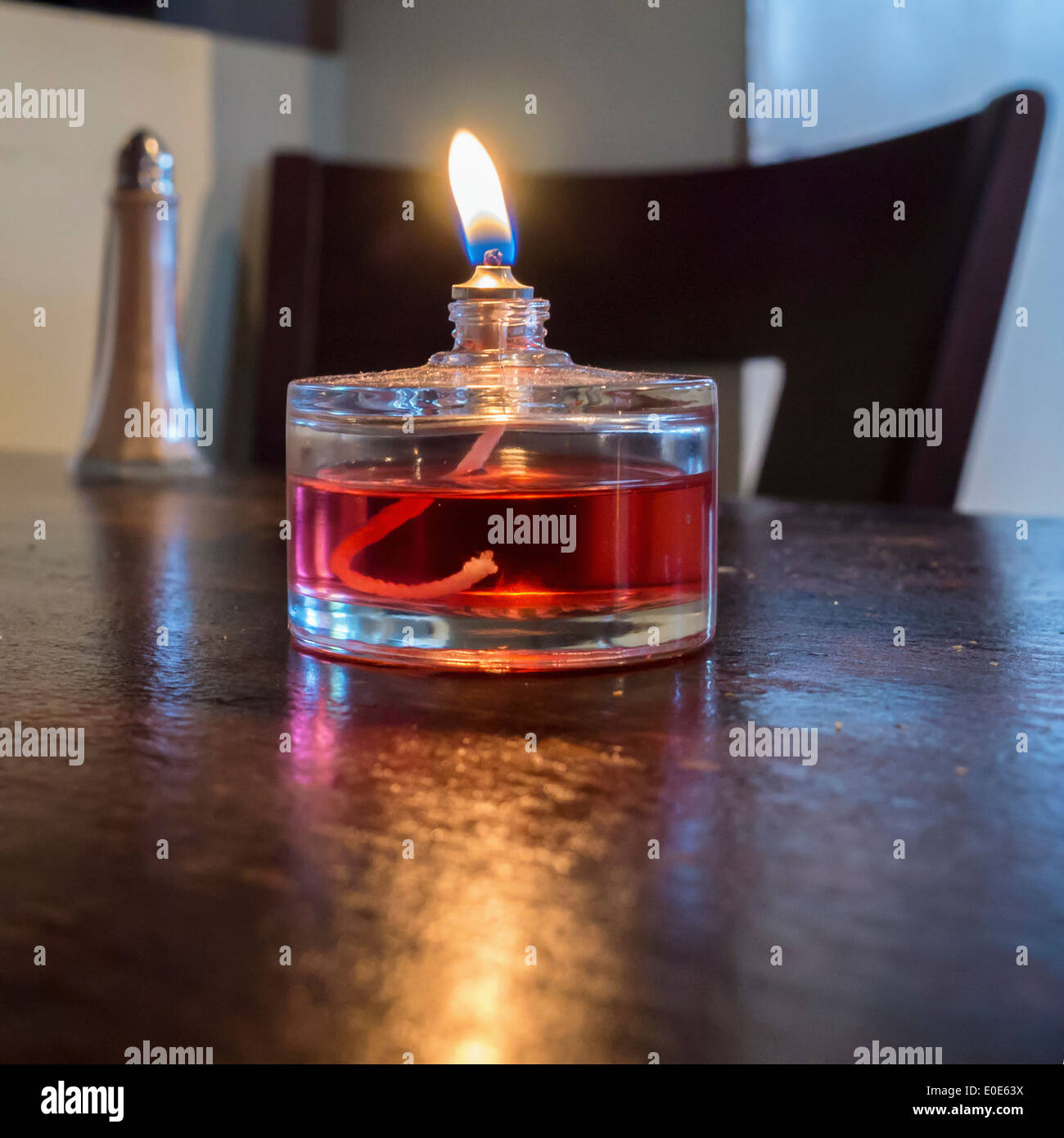 Tealight candle with liquid coloured fuel Stock Photo Alamy