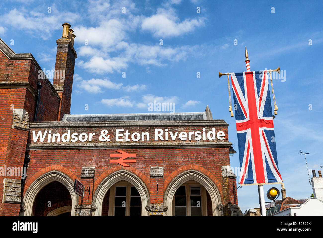 Windsor and Eton railway station brick building and Union Jack flag - Windsor, Berkshire, UK Stock Photo