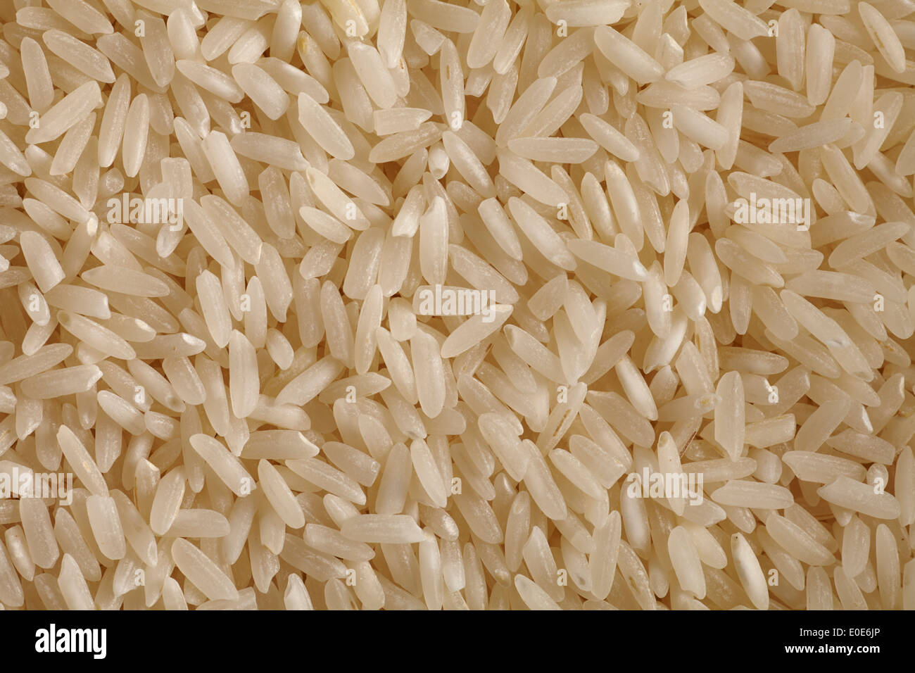 raw, uncooked long-grain white rice Stock Photo