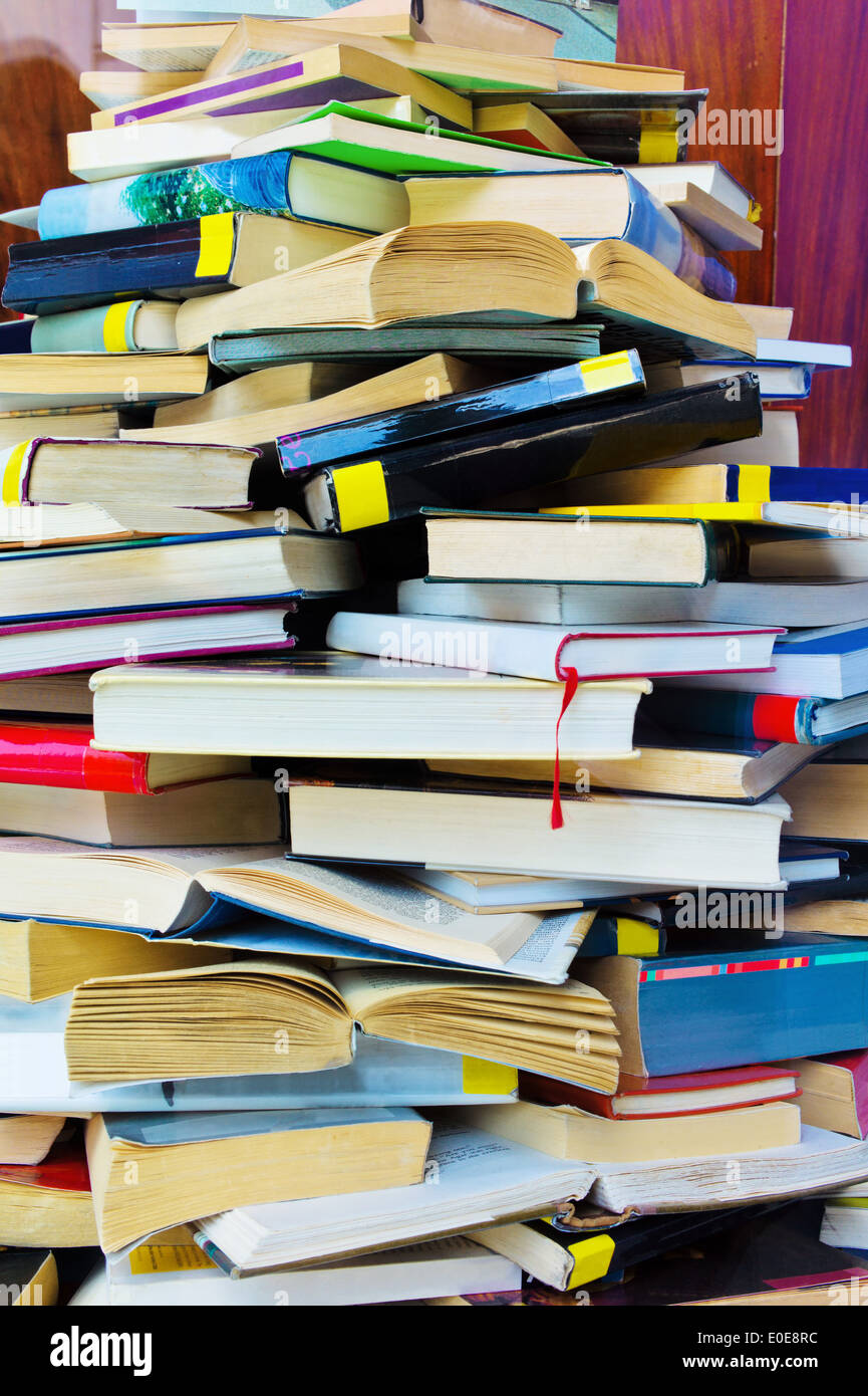 A pile completely whipped and closed books, Ein Stapel voll aufgeschlagen und geschlossener Buecher Stock Photo
